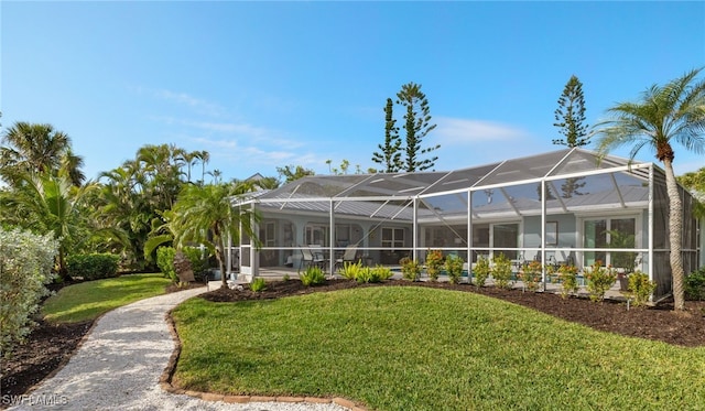 view of yard featuring glass enclosure