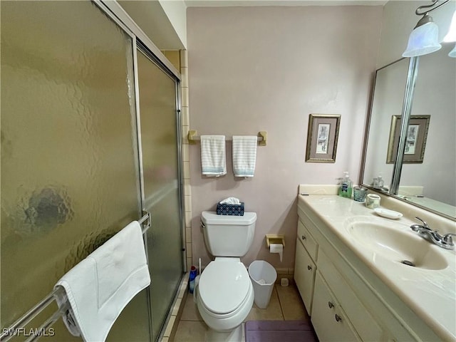 bathroom with walk in shower, tile patterned floors, toilet, and vanity