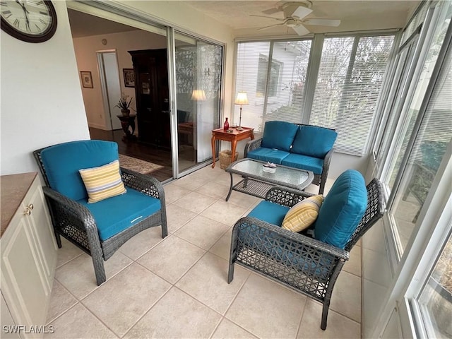 sunroom / solarium featuring ceiling fan