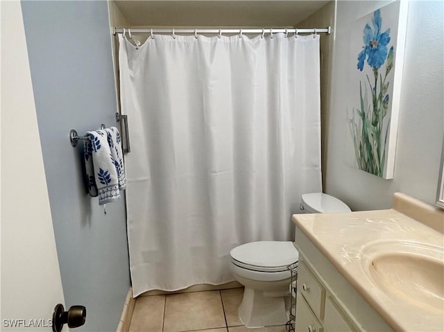 bathroom featuring tile patterned flooring, vanity, a shower with curtain, and toilet