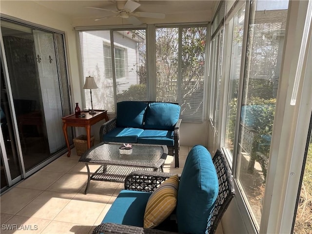 sunroom / solarium featuring a wealth of natural light and ceiling fan