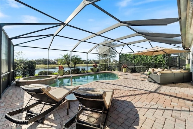 view of pool with a lanai, a water view, an outdoor living space, a patio area, and an in ground hot tub