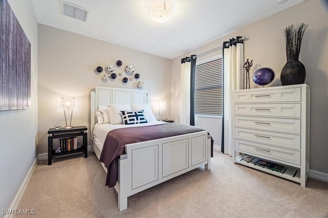 bedroom with light colored carpet