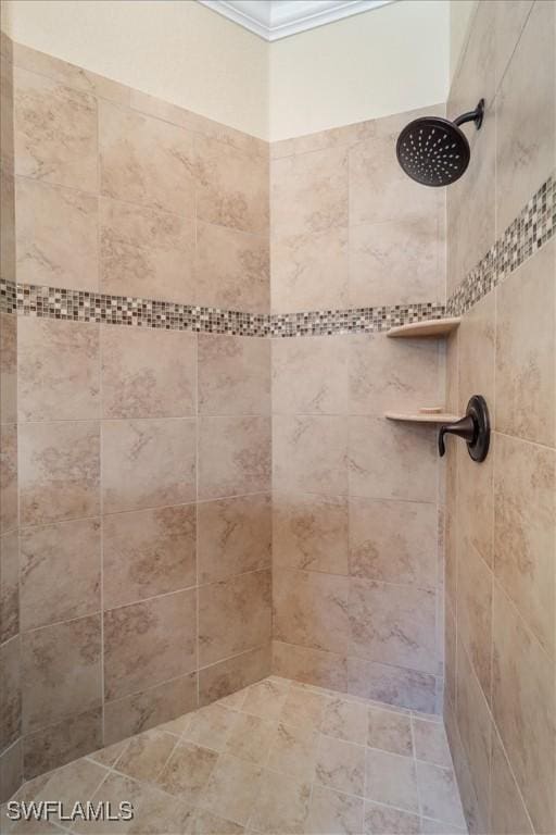 bathroom with tiled shower