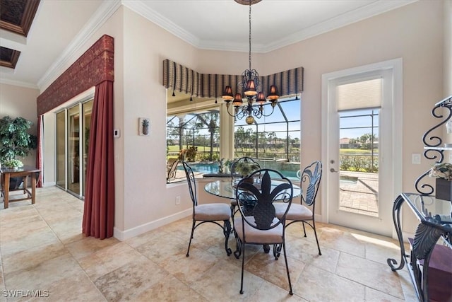 dining area featuring ornamental molding and a notable chandelier