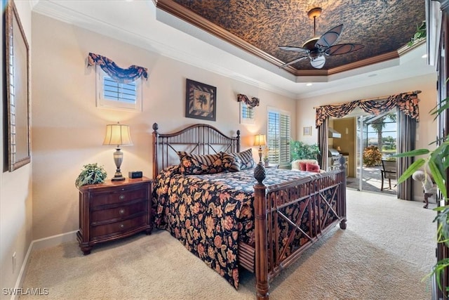 carpeted bedroom featuring crown molding, ceiling fan, access to exterior, and a raised ceiling