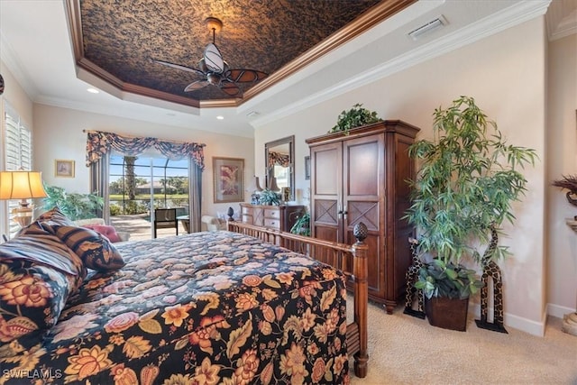 carpeted bedroom featuring crown molding, ceiling fan, a tray ceiling, and access to exterior