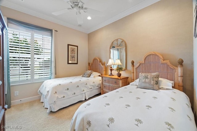 carpeted bedroom with crown molding and ceiling fan