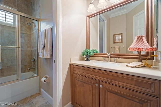 bathroom featuring vanity, crown molding, and enclosed tub / shower combo