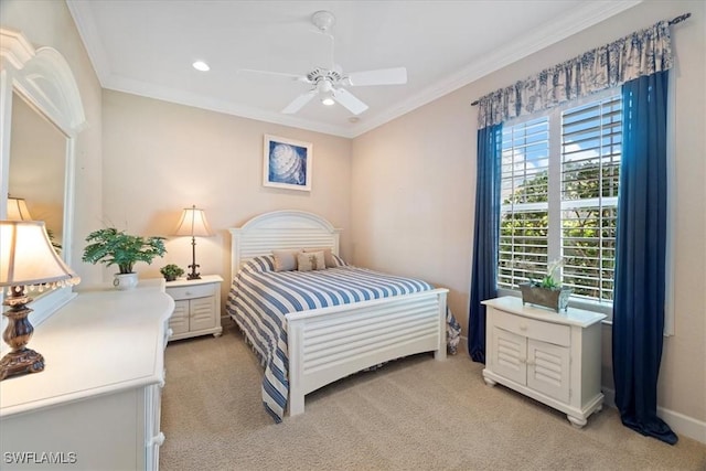 bedroom with ceiling fan, light colored carpet, and ornamental molding