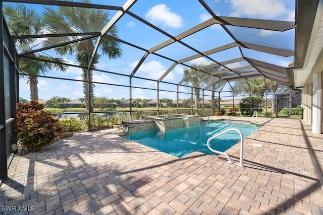 view of swimming pool with an in ground hot tub, a water view, glass enclosure, and a patio