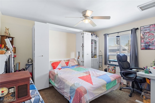 bedroom featuring dark carpet and ceiling fan