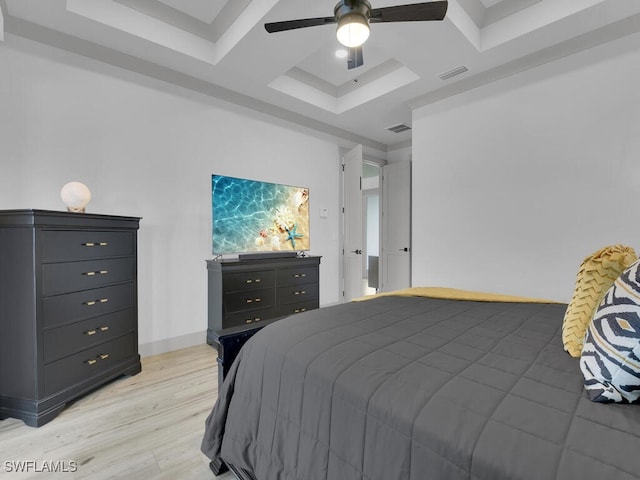 bedroom featuring coffered ceiling, light hardwood / wood-style floors, and ceiling fan