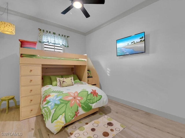 bedroom with ceiling fan and light wood-type flooring