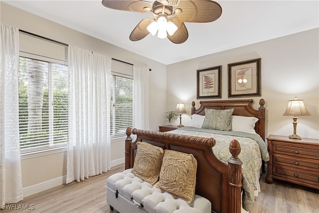 bedroom with light wood-type flooring and ceiling fan