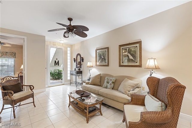 living room featuring ceiling fan and light tile patterned floors