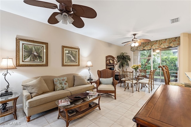 tiled living room with ceiling fan