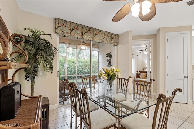 tiled dining area featuring ceiling fan