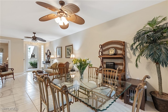 tiled dining room featuring a fireplace