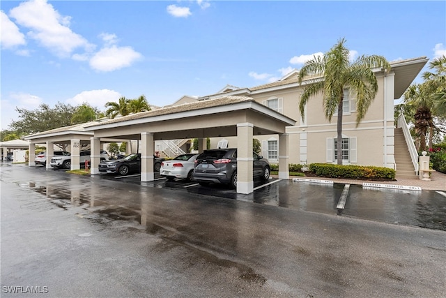 view of vehicle parking featuring a carport