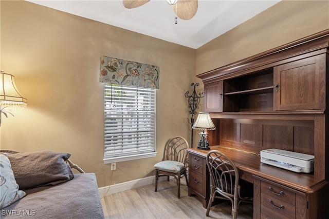 office space with light hardwood / wood-style floors and ceiling fan