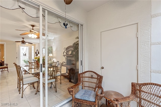 dining room with ceiling fan and light tile patterned floors