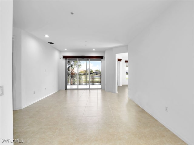 empty room featuring light tile patterned floors