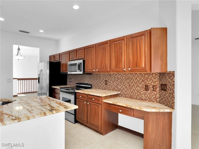 kitchen featuring light tile patterned flooring, sink, backsplash, stainless steel appliances, and light stone countertops