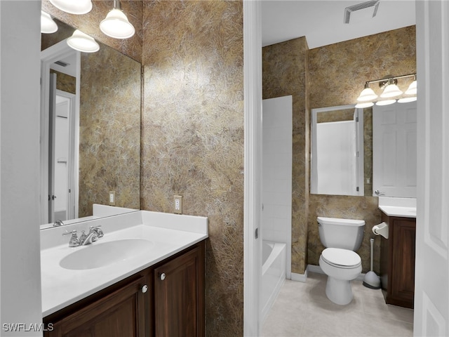 full bathroom featuring tile patterned flooring, vanity, shower / bath combination, and toilet