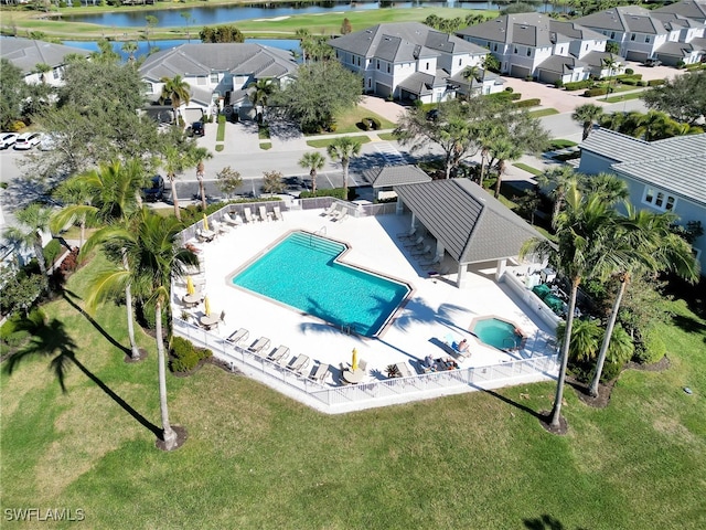 birds eye view of property featuring a water view