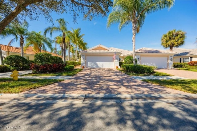 mediterranean / spanish-style home featuring a garage