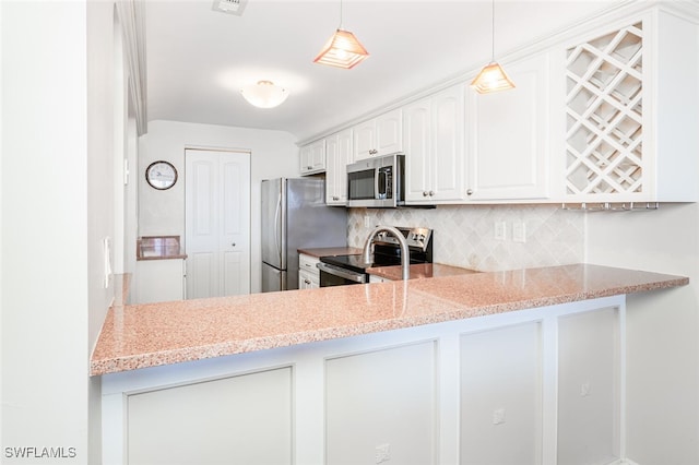 kitchen featuring pendant lighting, white cabinetry, backsplash, stainless steel appliances, and light stone countertops