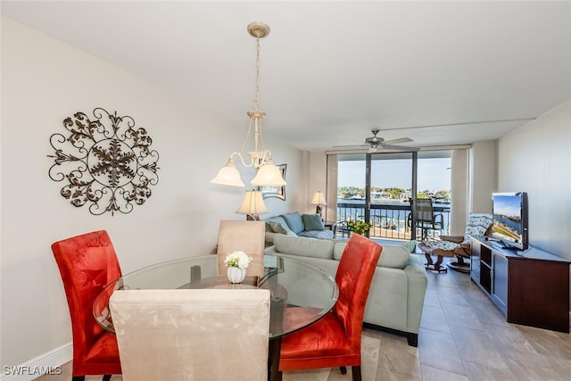 tiled living room with ceiling fan and floor to ceiling windows