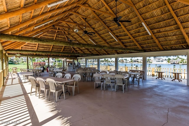 view of patio featuring a gazebo, a water view, and ceiling fan