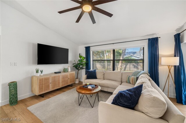 2451 River Reach Dr, Naples, FL 34104 - living area featuring a ceiling fan, baseboards, vaulted ceiling, and wood finished floors