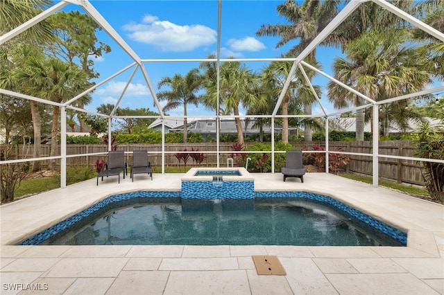 view of pool featuring a patio, an in ground hot tub, and glass enclosure