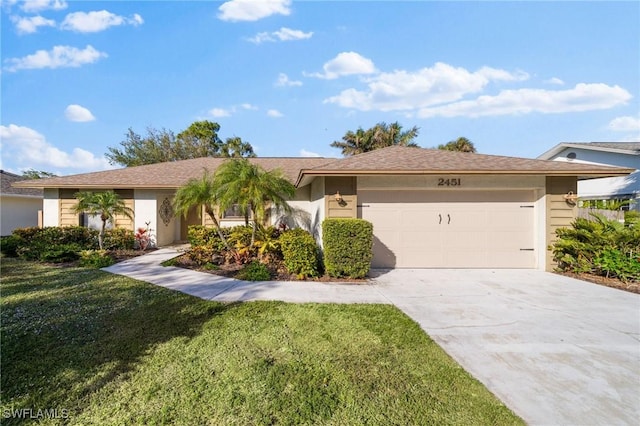 ranch-style home featuring a garage and a front yard