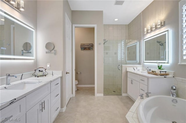 full bathroom featuring toilet, vanity, and shower with separate bathtub