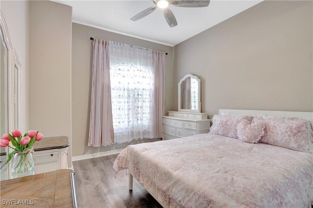 bedroom featuring ceiling fan and light hardwood / wood-style flooring