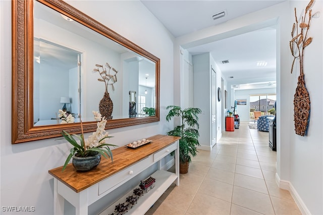 corridor featuring light tile patterned floors