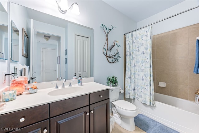 full bathroom with vanity, shower / tub combo, and toilet