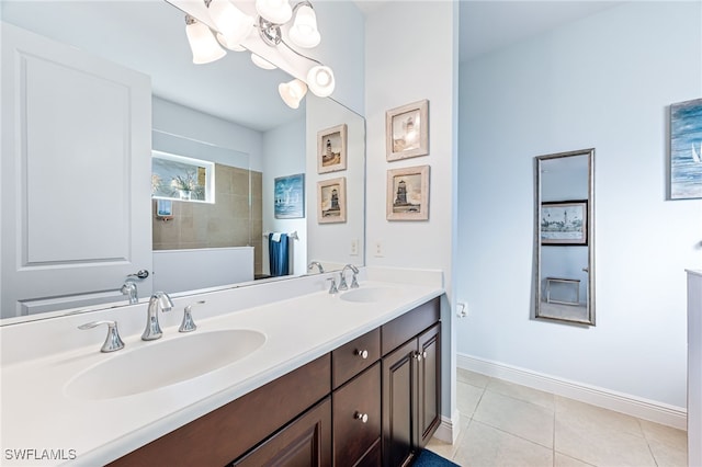 bathroom with vanity, a shower, and tile patterned floors