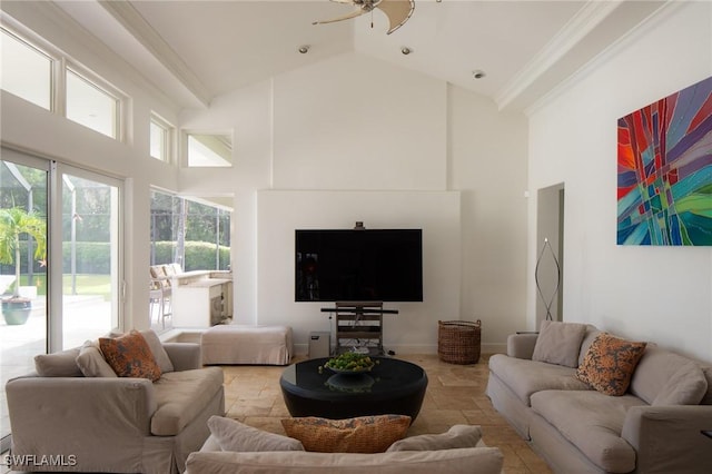 living room featuring ceiling fan and high vaulted ceiling