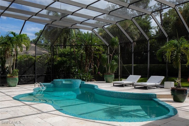 view of pool with glass enclosure and a patio