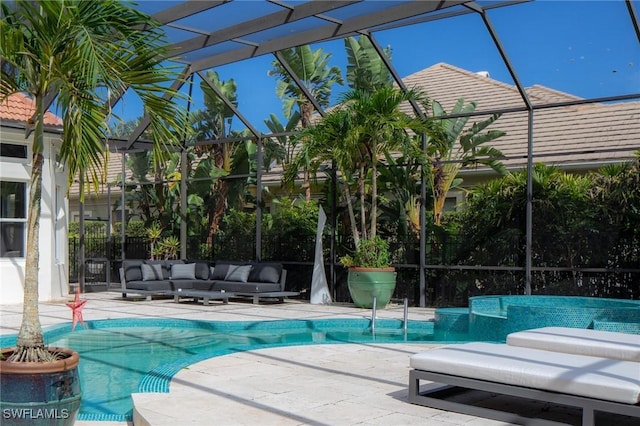 view of pool featuring a lanai, an outdoor living space, and a patio area