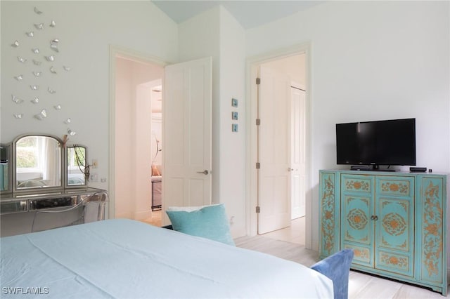 bedroom with vaulted ceiling