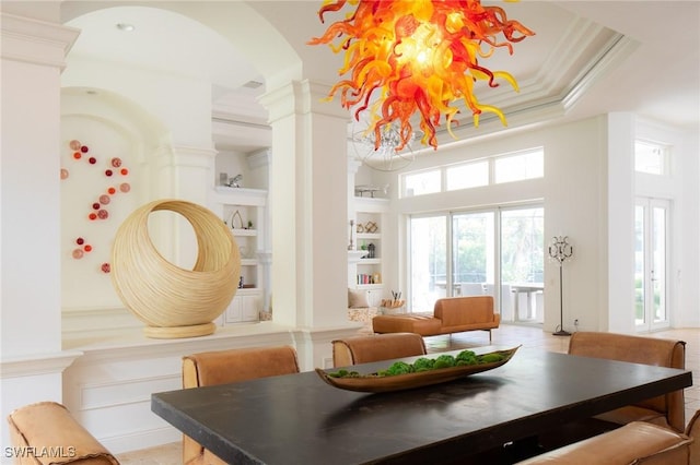 dining space featuring crown molding and built in shelves