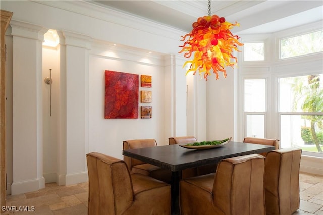 dining room featuring plenty of natural light and crown molding