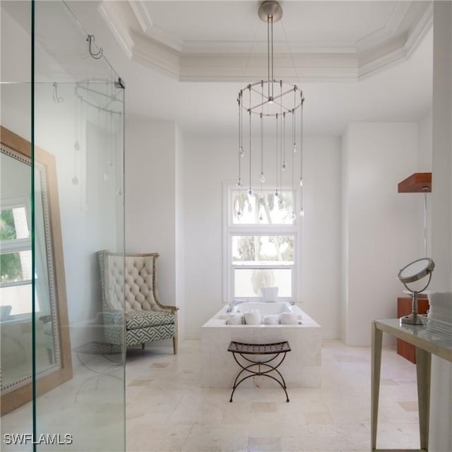 living area with crown molding, an inviting chandelier, and a tray ceiling