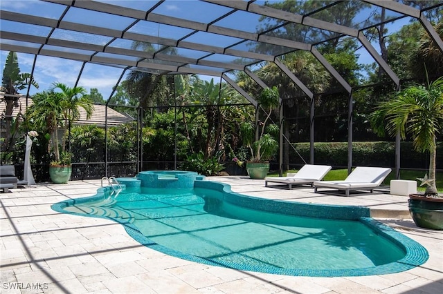 view of swimming pool with a lanai and a patio area